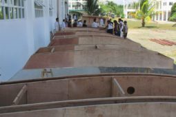 Maritime college Students building 10 oz goose sailboats in the Philippines